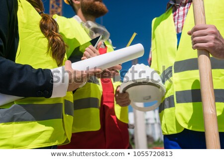 Man And Woman Holding Blueprint Stockfoto © Kzenon