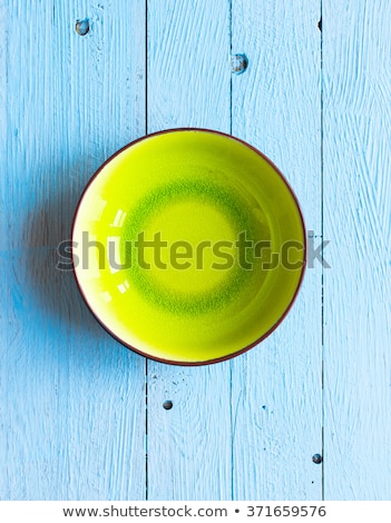 Stock fotó: Colorful Blue Dish Over A Light Blue Painted Wood Table