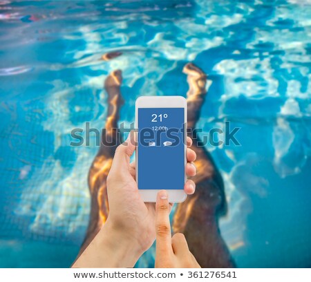 Stok fotoğraf: Man Relaxing In A Portable Swimming Pool