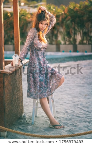 Stockfoto: Young Asian Fashion Woman Drinking Cocktail In A Beach Bar