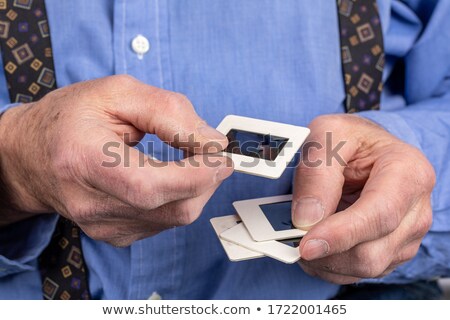 Stok fotoğraf: Man With A Filmstrip In His Hand