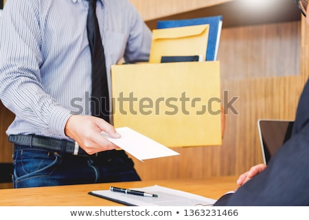 Foto d'archivio: Hand Of A Businessman Hands Over A Resignation Letter Final Remu