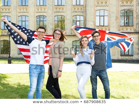 Stockfoto: Group Of Smiling Friends With British Flag