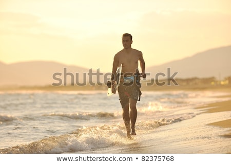 Portrait Of A Young Kitsurf Man At Beach On Sunset Foto stock © dotshock