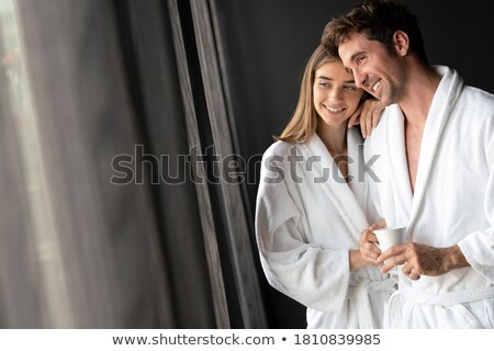 Foto stock: Portrait Of A Couple In Robes