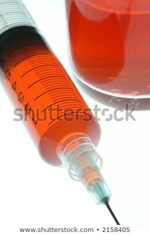 Zdjęcia stock: Syringe Lit By Red Light