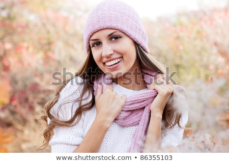 Stock photo: Beautiful Colored Girl With Curls Wearing A Cap