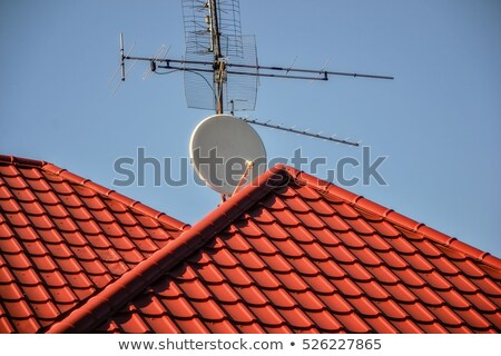 [[stock_photo]]: Home Tv Antennas Mounted On A Roof