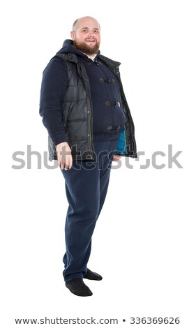 Foto stock: Jolly Fat Man In A Dark Warm Clothes