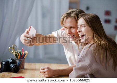 [[stock_photo]]: Portrait Of Romantic Couple Holding Hands While Having Meal