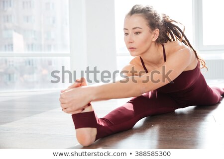 Сток-фото: Young Sportive Dancer Stretching In Studio