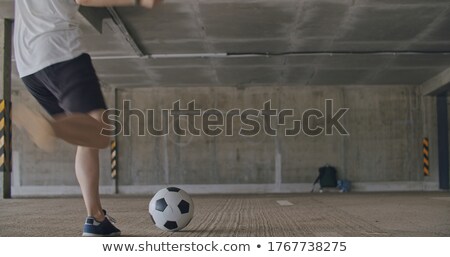 Zdjęcia stock: Footballers Playing By Garages