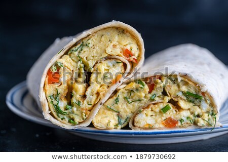 Foto stock: Egg Omelet With Tortilla Bread In A Plate