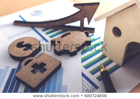 [[stock_photo]]: Financial Banking Stock Spreadsheet With House Piggy Medical