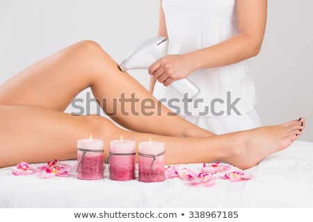 Foto stock: Laser Hair Removal Therapy On A Leg Of Woman Customer