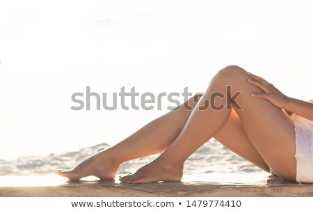 Zdjęcia stock: Beautiful Woman Legs On The Beach At Sunset