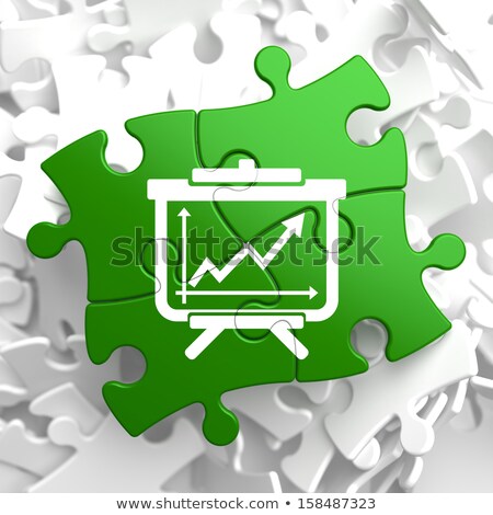 Flipchart With Growth Chart Icon On Green Puzzle [[stock_photo]] © Tashatuvango