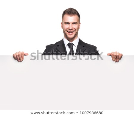 Young Man In Suit Holding A Blank Signboard Foto d'archivio © doodko