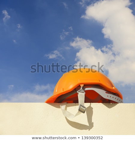 Stock photo: Worker Silhouette With Yellow Protective Headgear