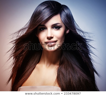Stock photo: Fashion Model With Hair Blowing In The Wind In Studio