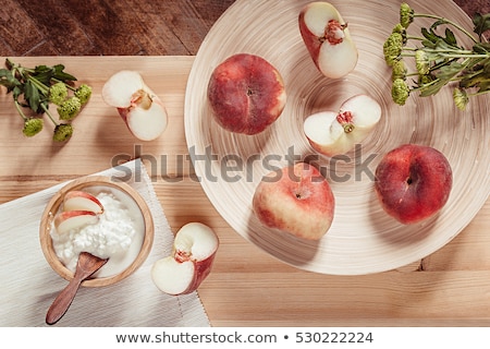 Stok fotoğraf: Breakfast With Ripe Peaches And Cottage Cheese On Wood Board Background Top View