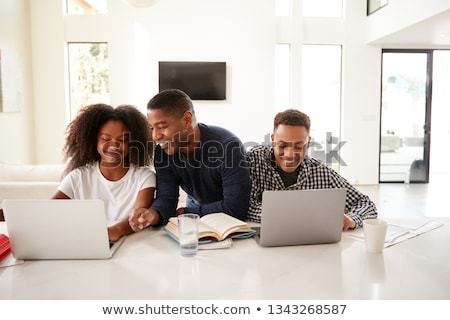 Foto stock: Father Helping Son Do Homework Parent Helps His Child