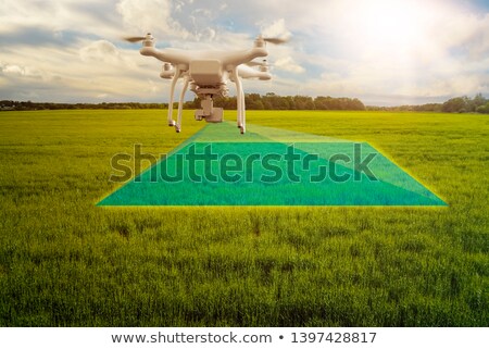 Stockfoto: Multicopter Drone Flying Over Crops Field