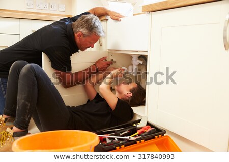 Foto stock: Plumber With Young Female Apprentice