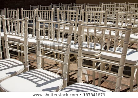 Stockfoto: Rows Of Wooden Chairs Set Up For Wedding