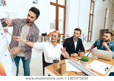 Stock photo: Businesswoman Listening To A Question And Explaining With Her Ma