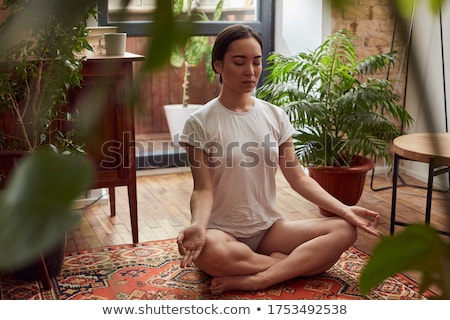 Сток-фото: Concentrated Young Asian Lady Posing With Plants