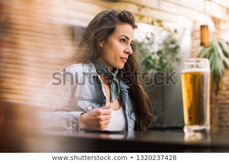 Foto d'archivio: Woman Having Milkshake In Restaurant