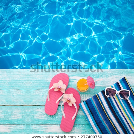 Foto stock: Pink Water And Wooden Boards In The Background