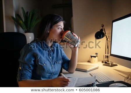 Stockfoto: Businesswomen Drinking Coffee At Night Office