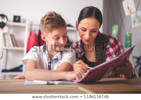 Stok fotoğraf: Mother Helping Her Son To Do The School Homework