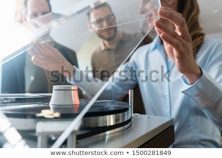 [[stock_photo]]: Woman Listening To Music From A Hi Fi Stereo