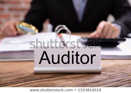 ストックフォト: Nameplate With Auditor Title Kept On Desk