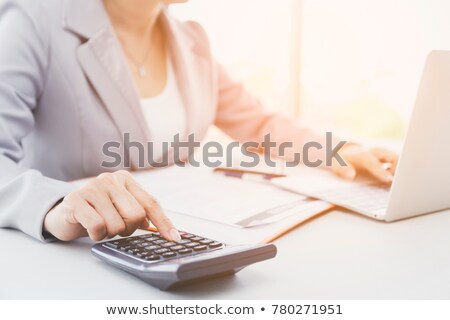 Foto stock: Business Woman Accountant Or Banker Making Calculations Bills D