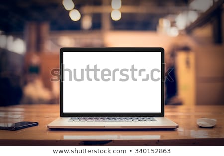 Foto stock: Home Office Workplace With Blank Screen Laptop