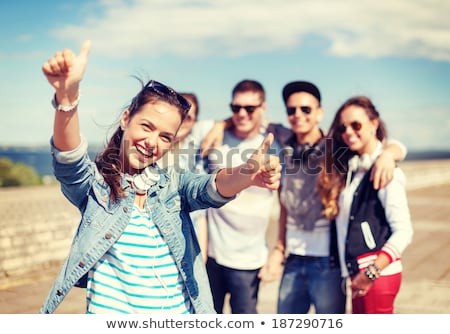 Stock photo: Boy In Headphones Showing Thumbs Up