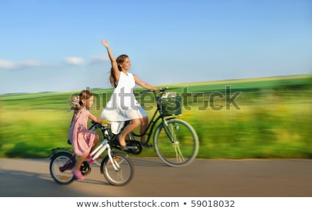 Foto stock: Country Girl With Bicycle And Flowers