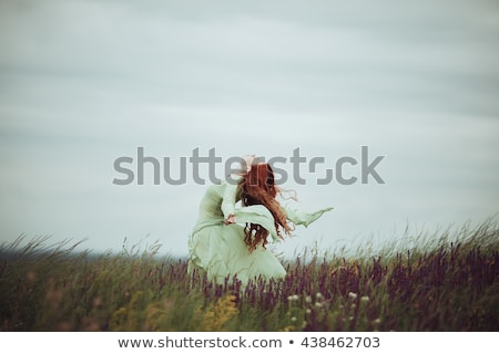 Foto d'archivio: Romantic Redhead Woman Relaxing Outdoors