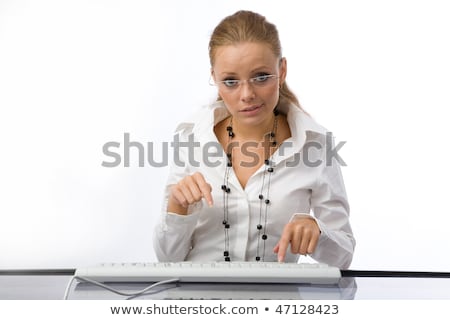 Stock photo: The Girl Puzzled Prints On The Keyboard