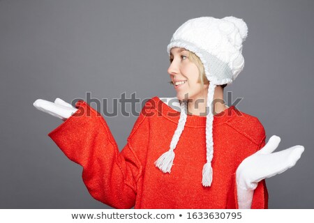 Stok fotoğraf: Lovely Pretty Cheerful Female In Grey Hat And Mittens Posing