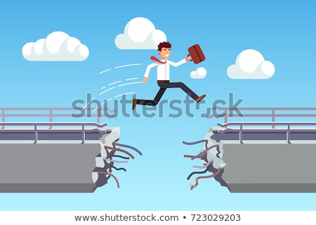 Foto stock: Energetic Business Man Jumping Over A Bridge With Gap