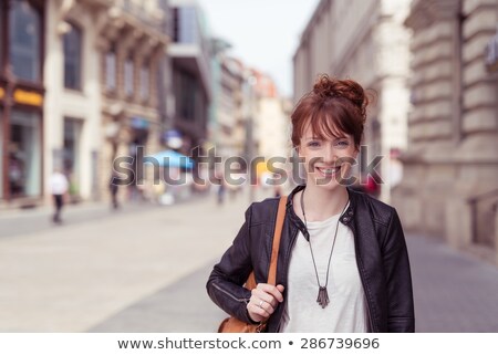 Stock fotó: Young Cool Hipster Walking With Jacket On Shoulder