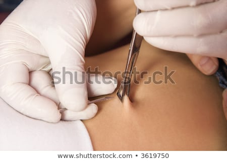 Two Belly Buttons Pierced Imagine de stoc © iofoto