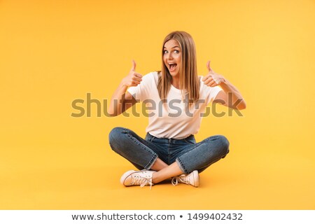 Stock fotó: Beautiful Blond Sitting Cross Legged On The Floor