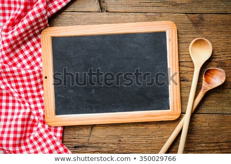 Stock photo: Recipe Book With Wooden Spoons On A Red Checkered Tablecloth