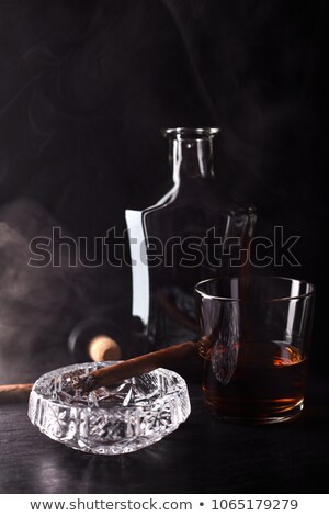 Stockfoto: Cognac And Tobacco Pipe On A Wooden Table